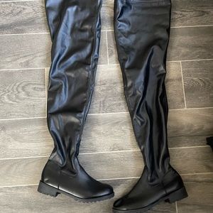 Wide legged black leather boots